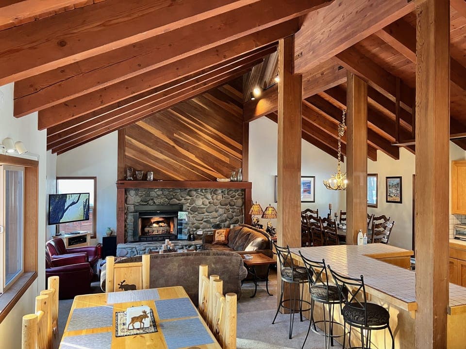 Large light Great Room with 4 areas: bonus table area, living, dining, kitchen