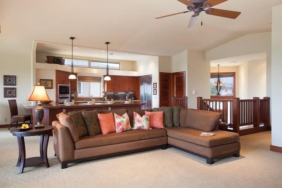 Open concept layout connects living room, dining, and kitchen