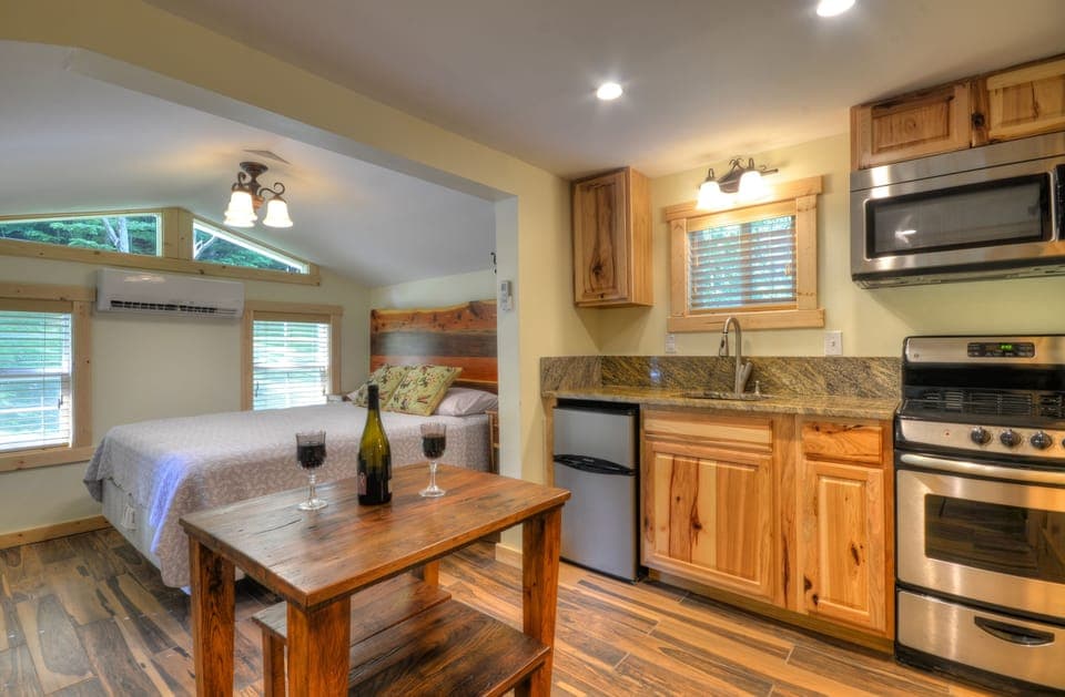 Efficient tiny cabin kitchen space while still provides everything within reach.