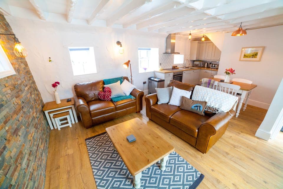 Beautiful open plan living area featuring a stunning welsh slate wall.