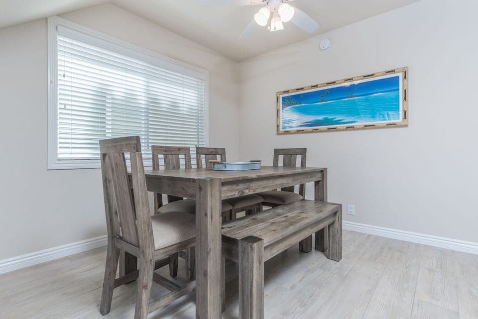 Dining area, adjacent to both kitchen and living areas, is the perfect headquarters for family meals, game night and good conversation.
                