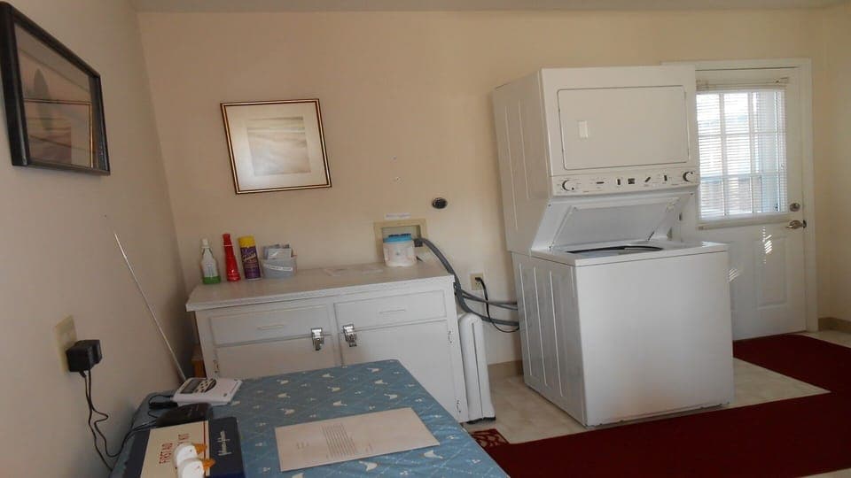 Laundry room area off of kitchen and door to back deck