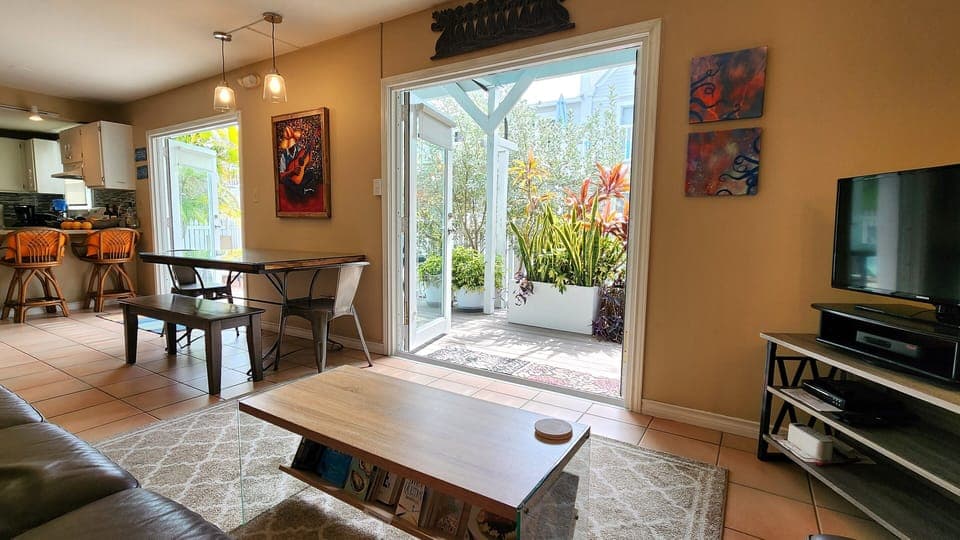 Comfortable and roomy living area with view of private backyard