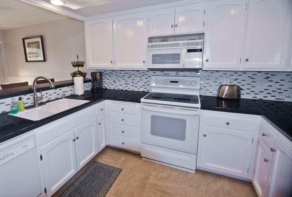 This is the remodeled kitchen with granite, dishwasher, upgraded appliances