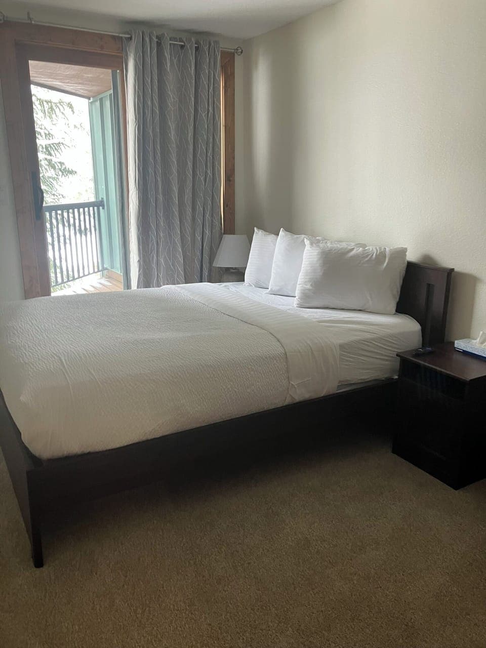 Bedroom 1.  Queen Bed. Balcony. TV.