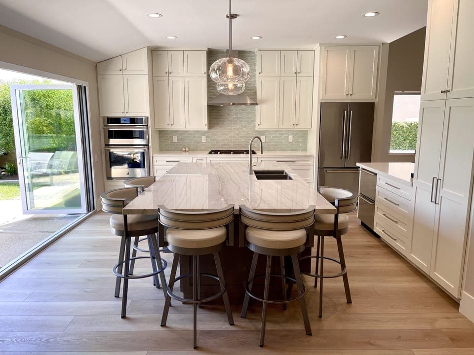 Fully stocked kitchen with JennAir appliances and second under-counter fridge.