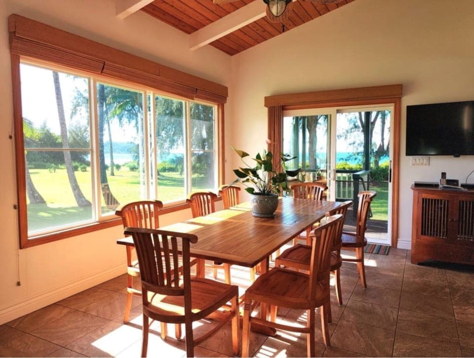 Ka Nani on Hanalei Bay Dining with Ocean Front Views - Gather in the spacious dining area with awesome Hanalei Bay views.