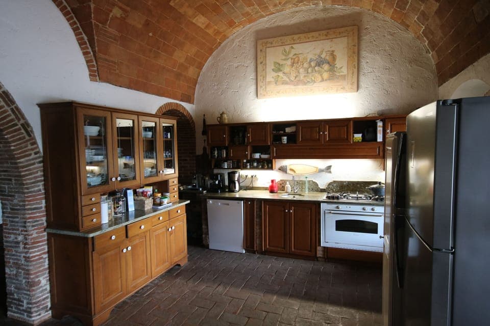 The main kitchen with the king size refrigerator (out of 4).