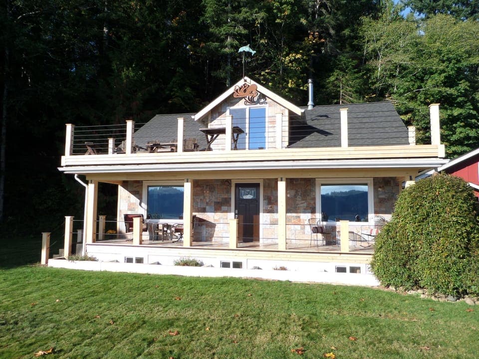 1920's farm house with upper and lower deck across from the Hood Canal