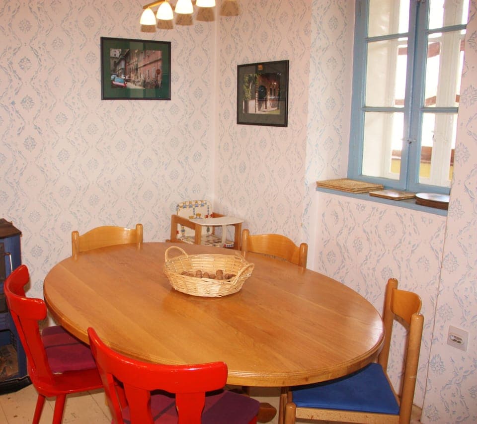 Dining area in the kitchen.  Natural light. High chair provided.