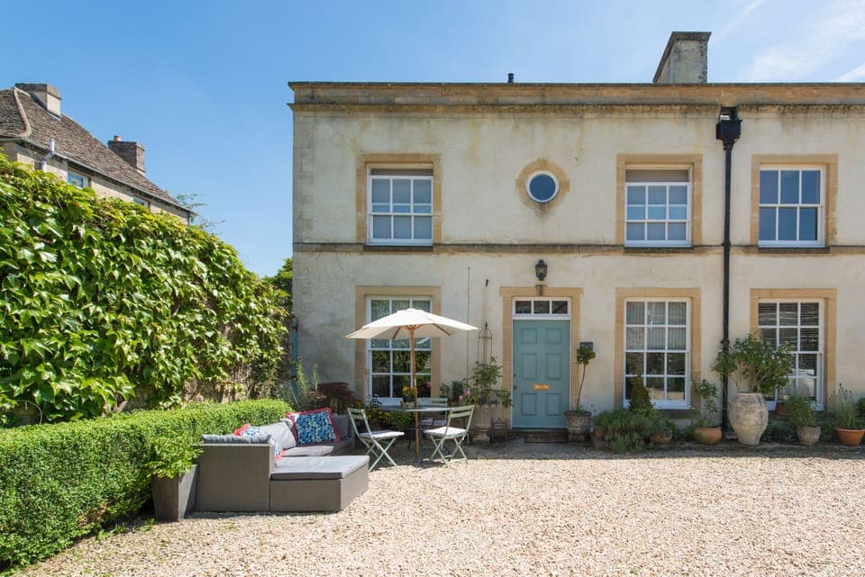 Exterior with outside seating and parking space for one car