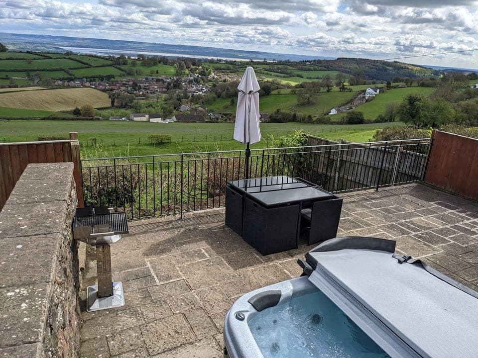 One of the highlights of this property is the private hot tub taking in the amazing views.