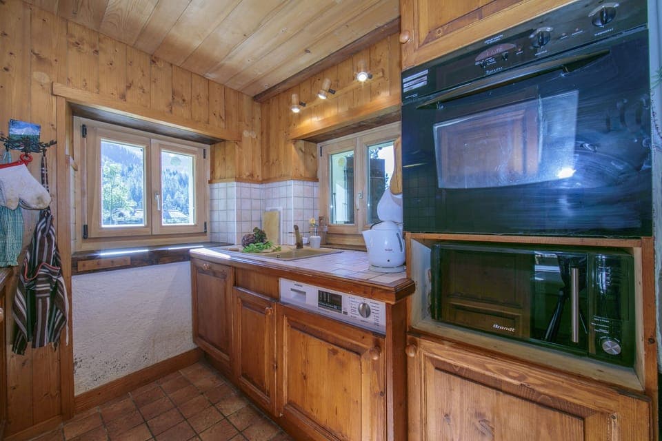 Kitchen with oven and microwave