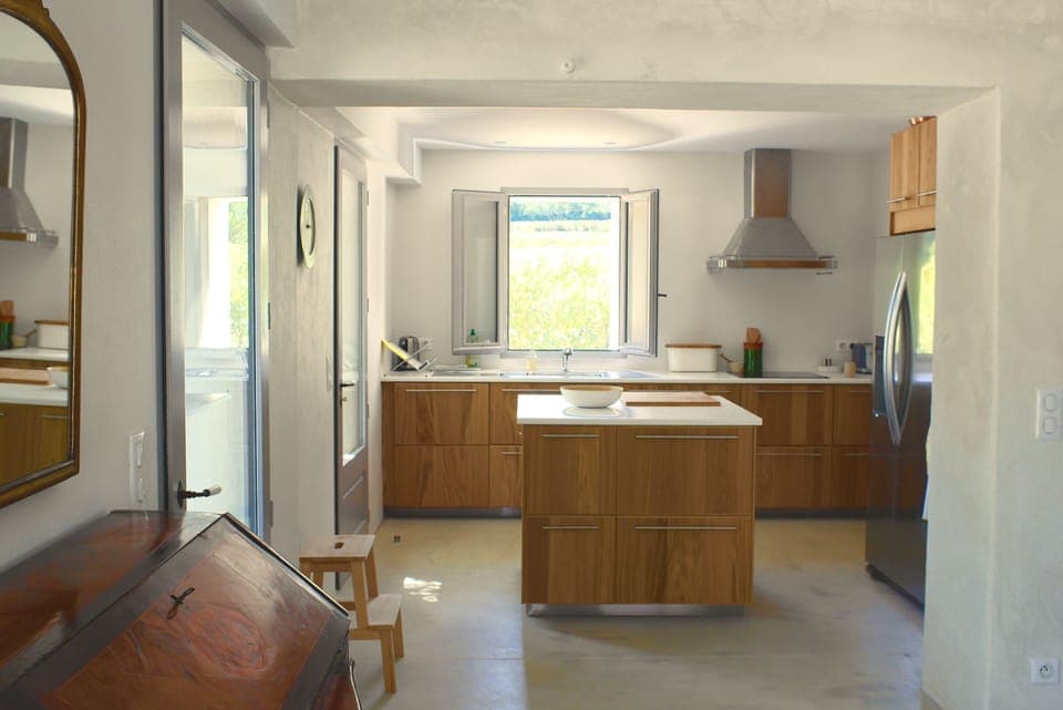 Fully equipped kitchen with adjoining laundry. 