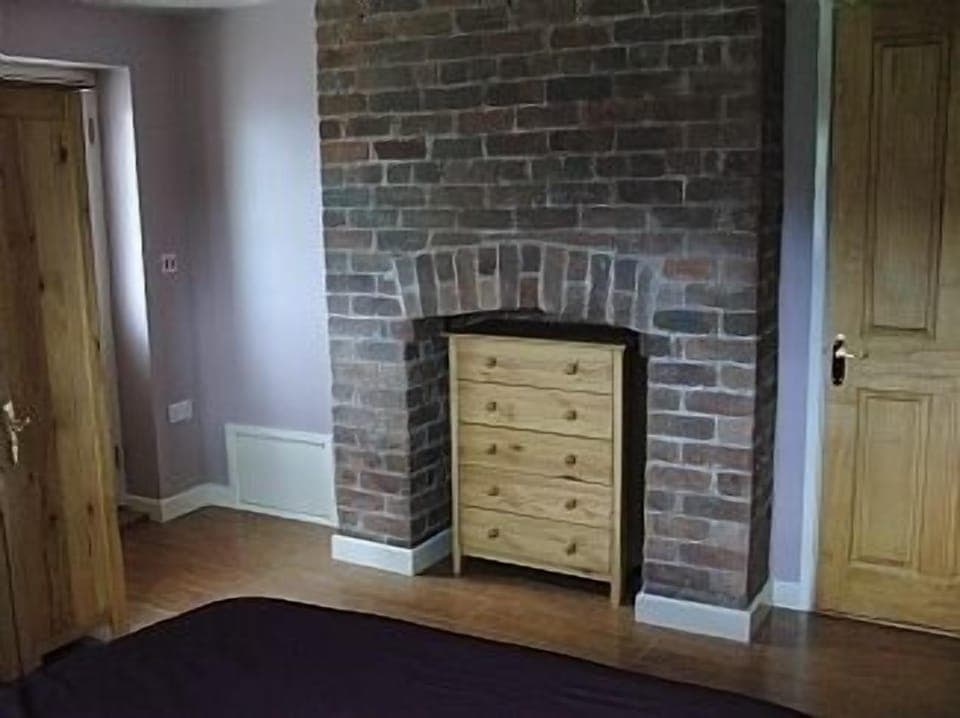 Original brickwork in bedroom