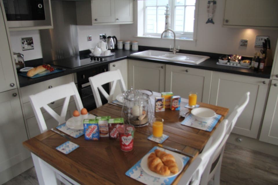 Shop on site for essentials juice cereals, bread, wine, treats, ham pizza cheese