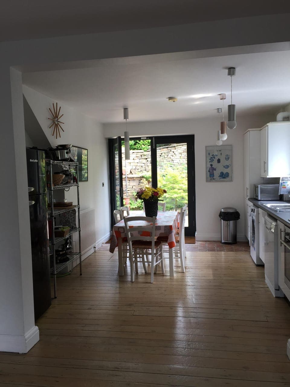 View of kitchen with patio doors leading to terrace area.