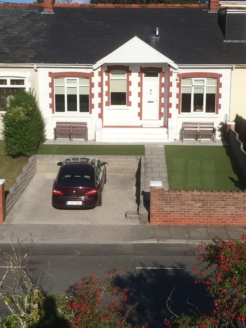Front of house with 2 car off road parking.
