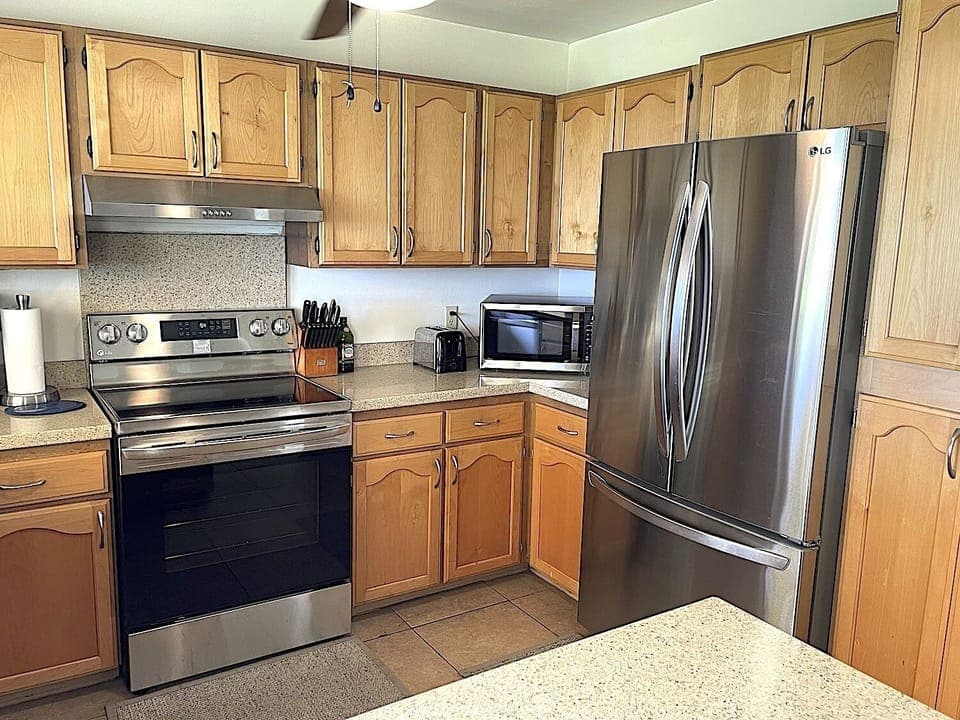 Renovated Kitchen with stainless appliances and granite counter tops (May, 2023