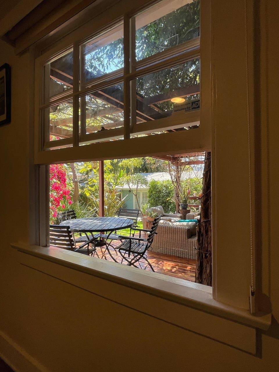 bedroom 1 - queen bed - colorful view of garden