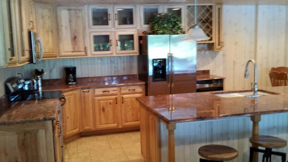 Kitchen with granite counter top and wine cooler fridge