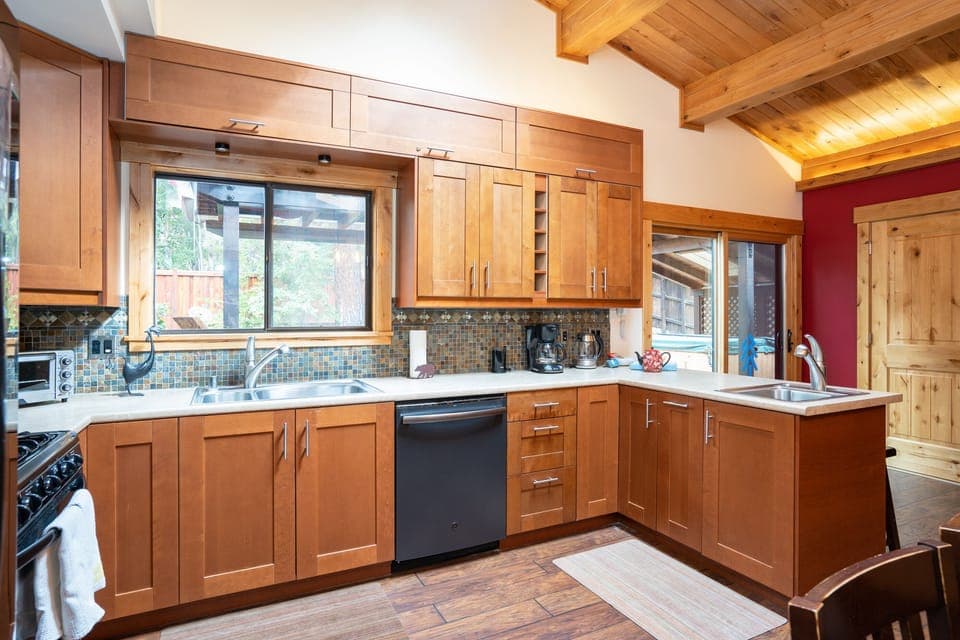 This recently remodeled kitchen is not only visually stunning but also fully equipped with everything you might need to prepare a home-cooked meal