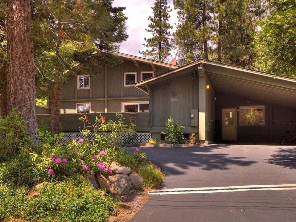 With a two-car carport and a three-car driveway, the front of the house provides ample parking space for multiple vehicles