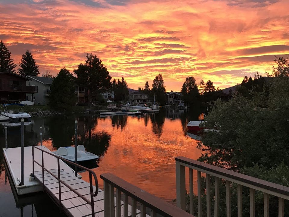 sunrise in back of house near personel boat dock