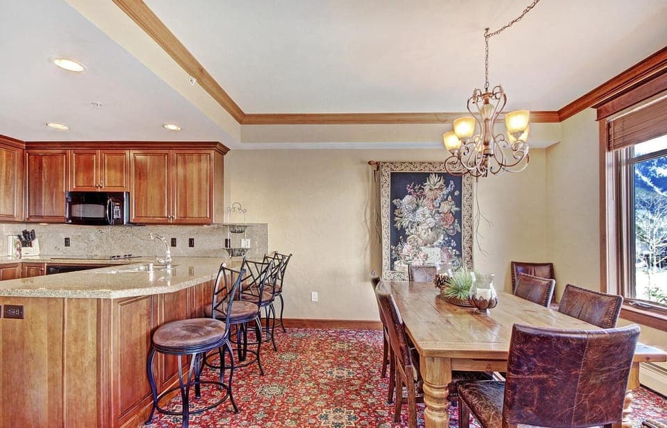 Dining for 6-8 people overlooking Center Village with mountain views.