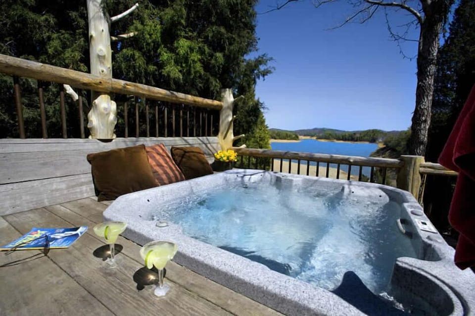 Relax in the jacuzzi + Enjoy the views of Douglas Lake right outside your door.