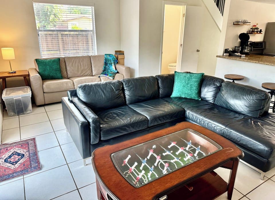 Bright open-concept living room and kitchen, perfect for relaxing and gathering.