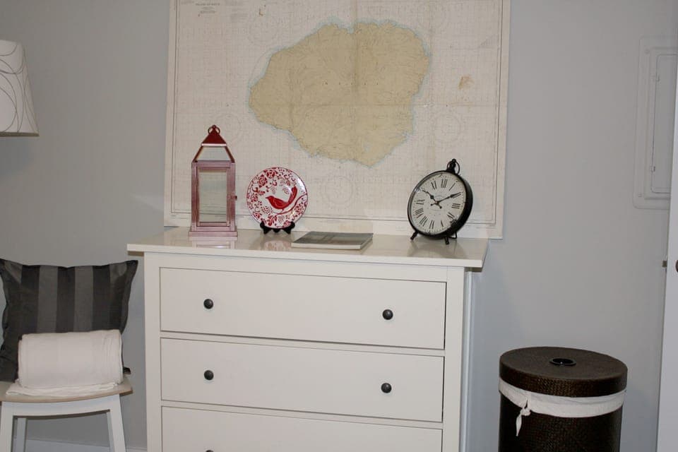 Bedroom, with queen size bed, has plenty of storage. Full dresser and closet with iron and ironing board.