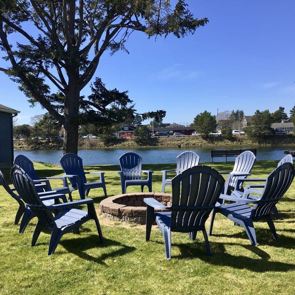 Backyard Fire Ring With Large Yard To The River's Edge