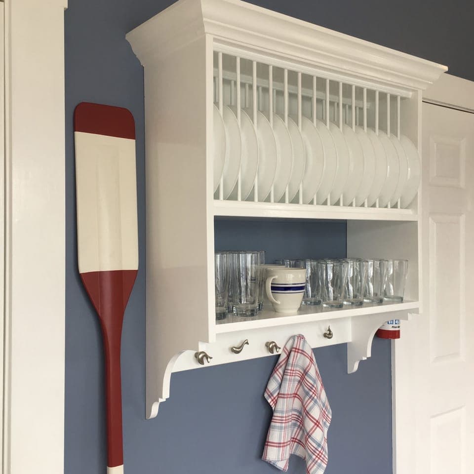 Some Of The Kitchen Tableware Is At Arms Reach. 