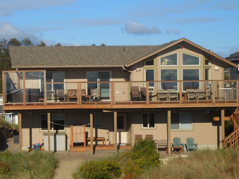Beach side of house, patio and deck.