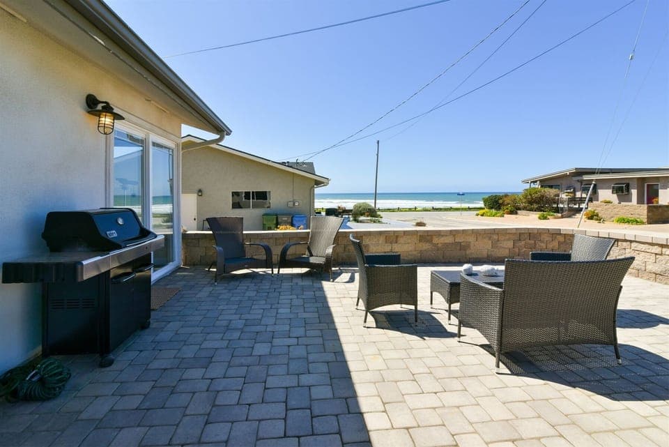 Enjoy sitting on this beautiful front patio listening to the surrounding surf.