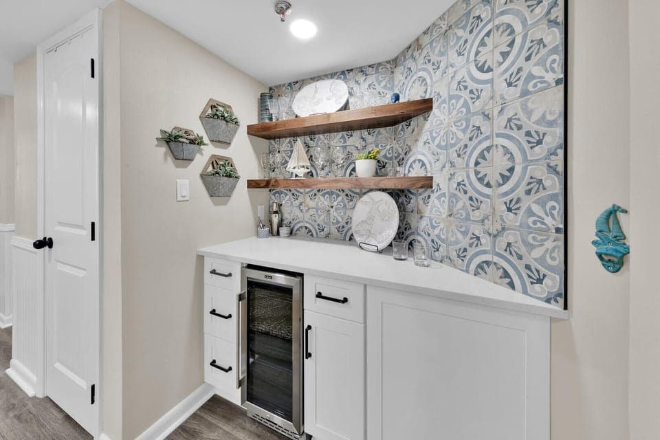 New wet bar with drink fridge, bottle openers, corkscrews & misc. bar supplies. 