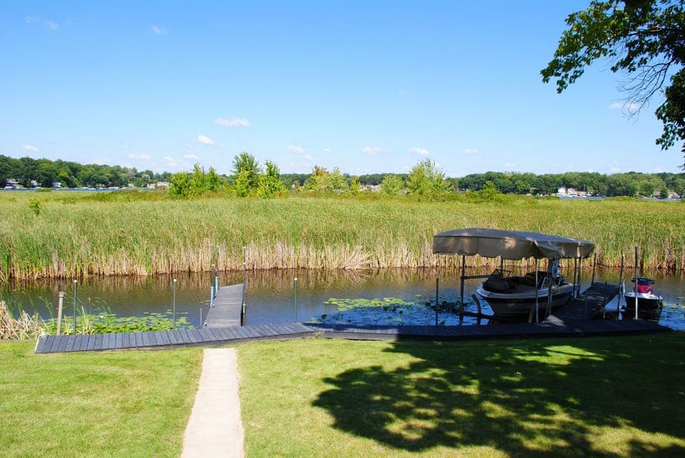 Your dock (left) in the backyard. Large enough for boats up to about 25 feet.