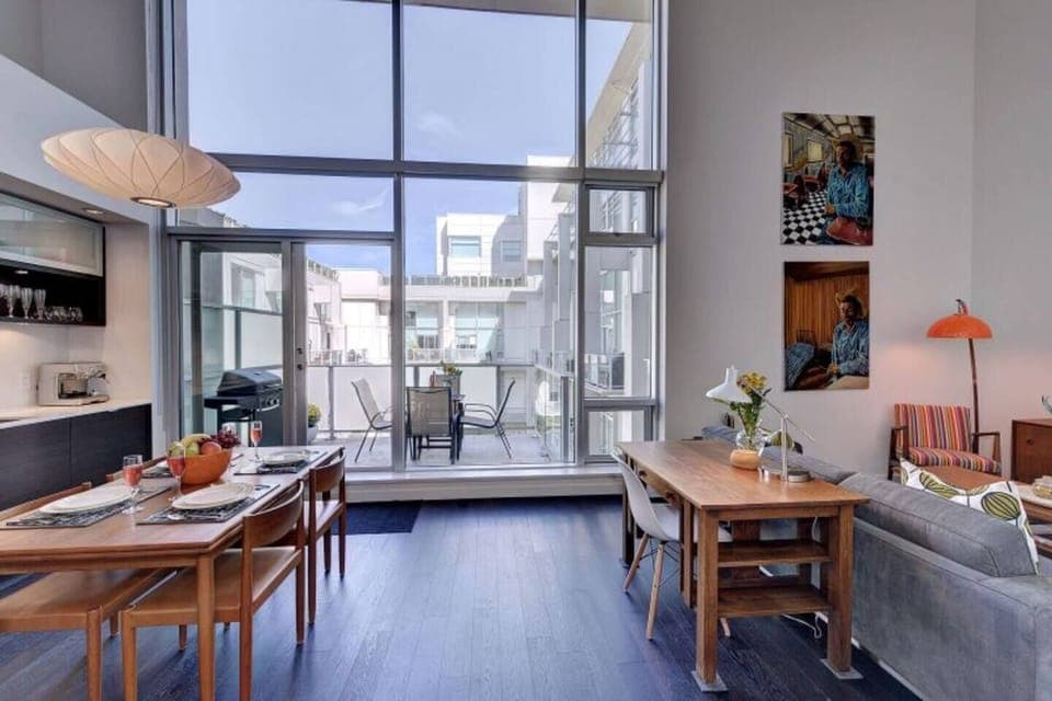 Floor to Ceiling Windows in this historic 2 bedroom 2 bath loft! 