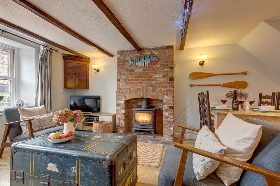 Alberts Cottage, Wells-next-the-Sea: Open plan living area with wood burning stove