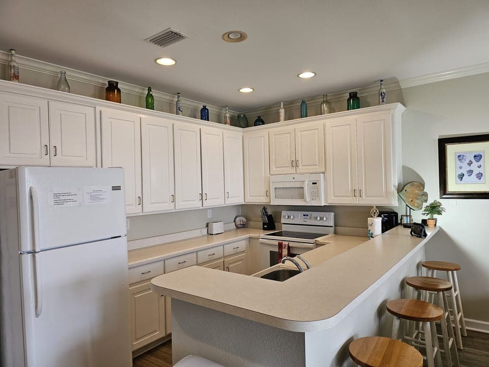 Kitchen - Fully Equipped Kitchen opens to Living Room and Dining Area