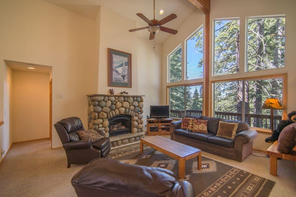 Living room with stone fireplace