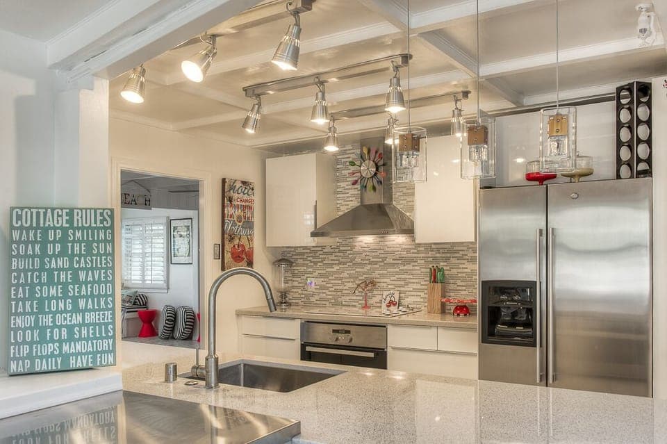 Completely new kitchen with microwave, oven, dishwasher,refrigerator with ice maker.  Quartz counter tops through out-stunning! Well stocked with pots, pans, dishes etc. Everything to make you feel at home.