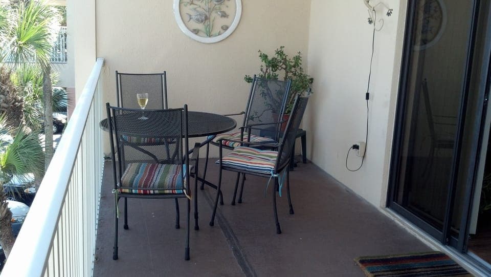 Balcony dining area 
watch for dolphins and manatees!