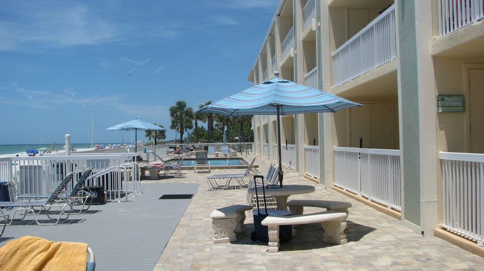 large roomy Patio with tables and grills, great place to have dinner and sunset!