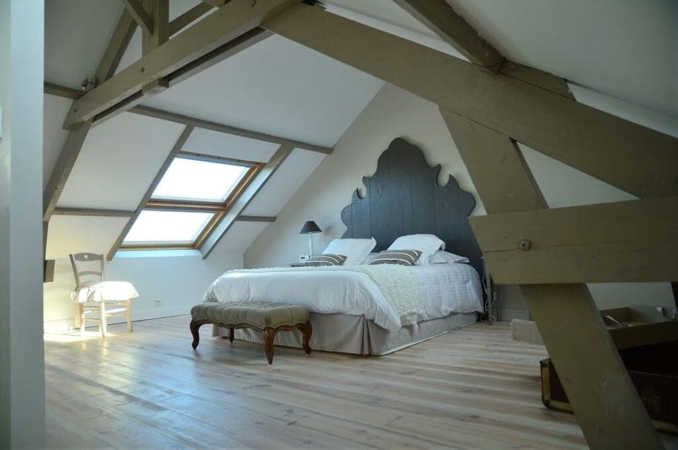 Master suite with window and unobstructed view of the beach and the sea.