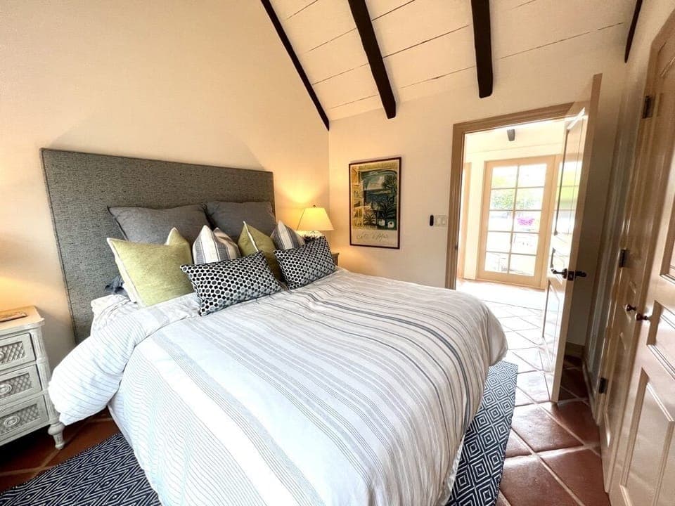 Bedroom #1 with door to attached bathroom. 