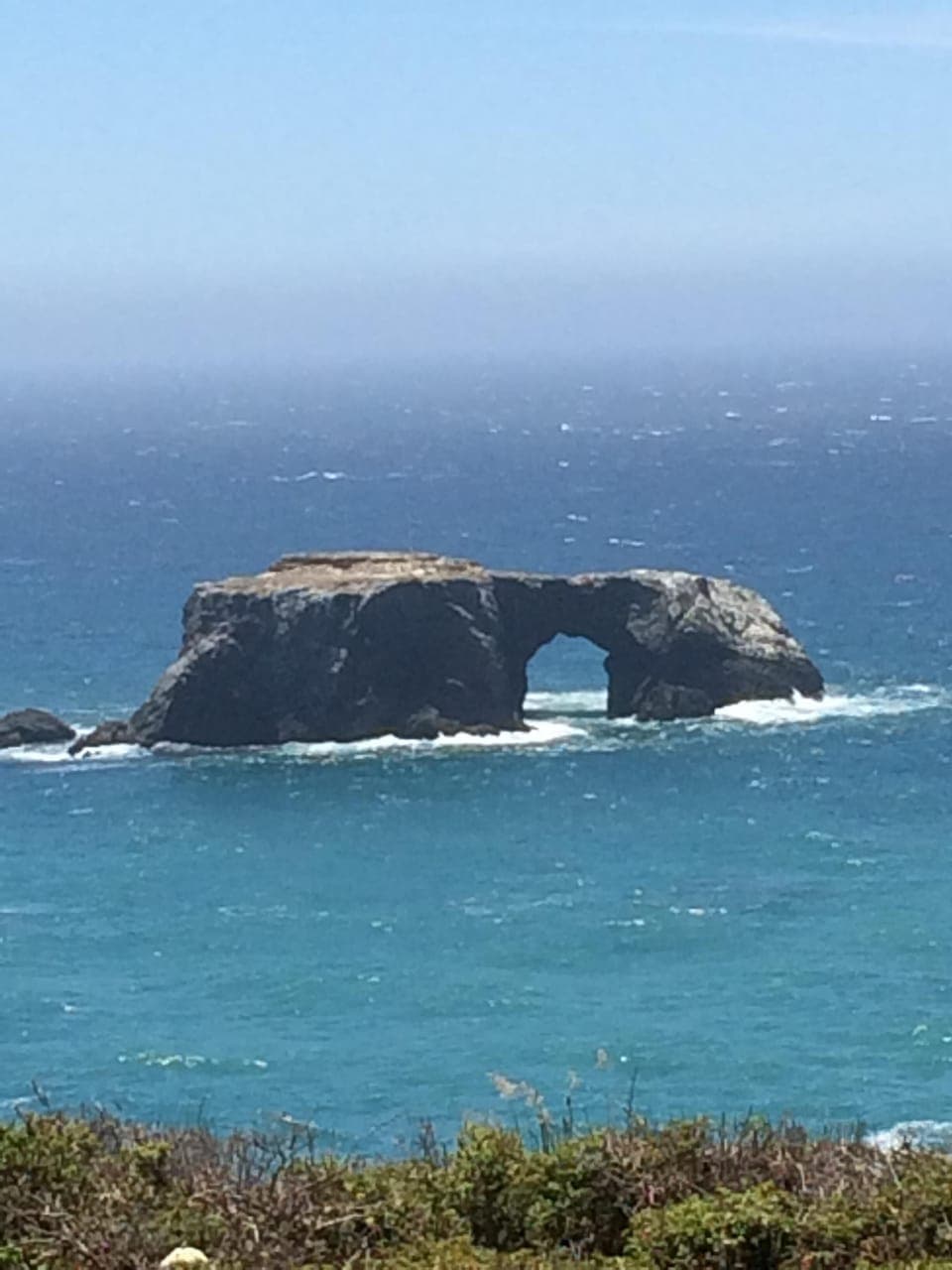 view of arch rock from private road to cabin