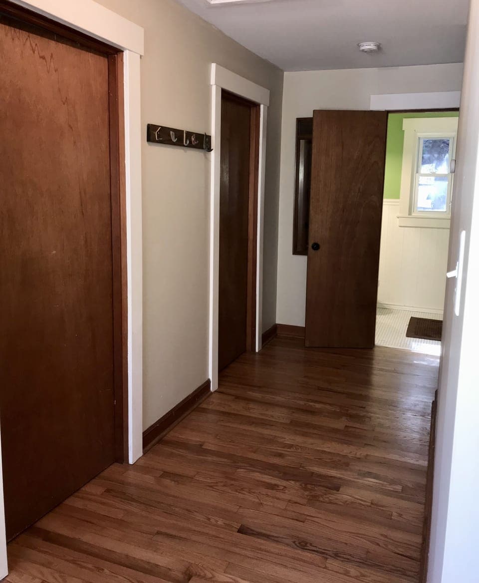 View of upstairs hallway and bath