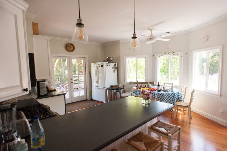 Kitchen table looks out on to the pool area.  Kitchen table seats 10